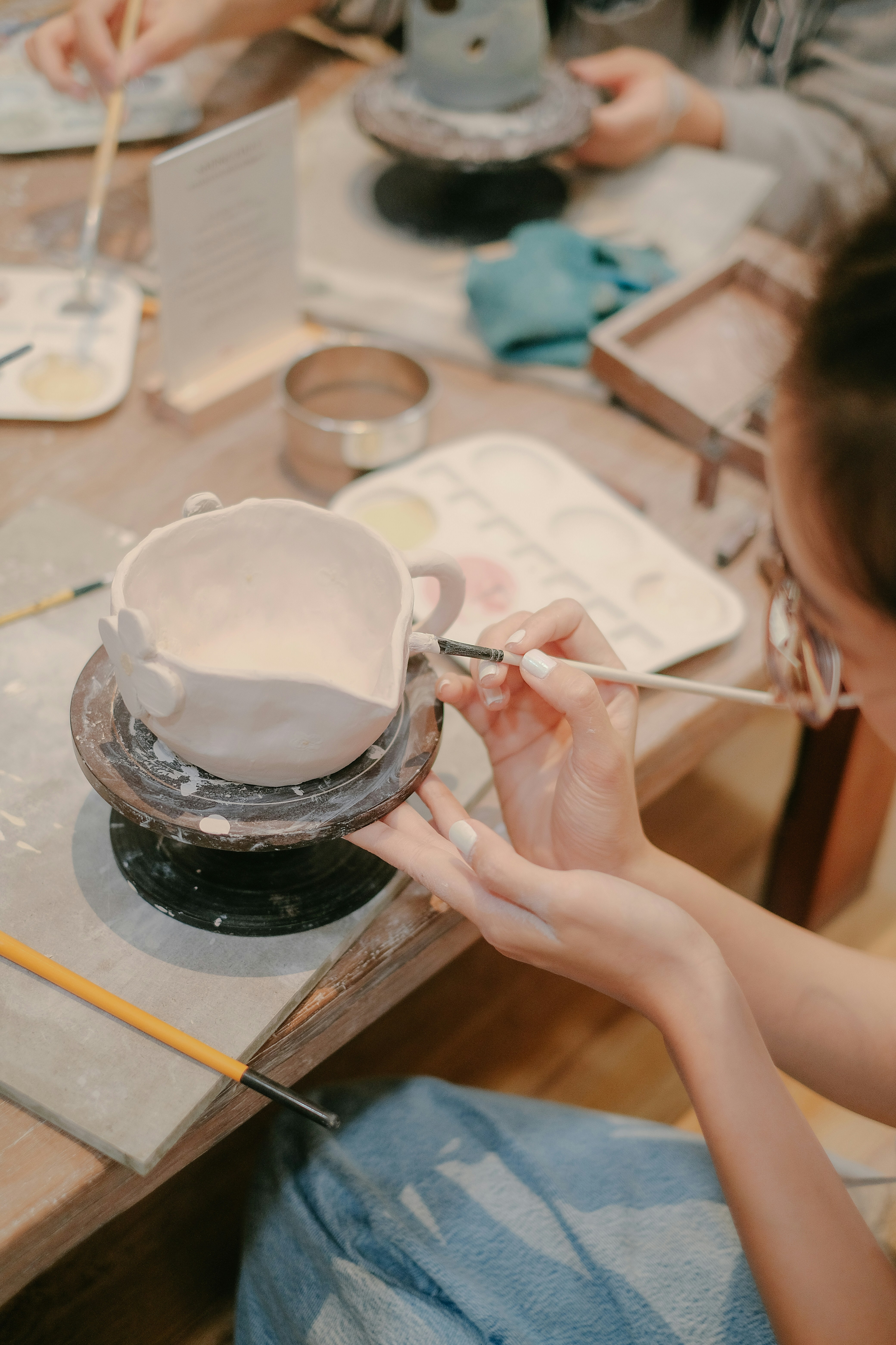 girl are carving the ceramic